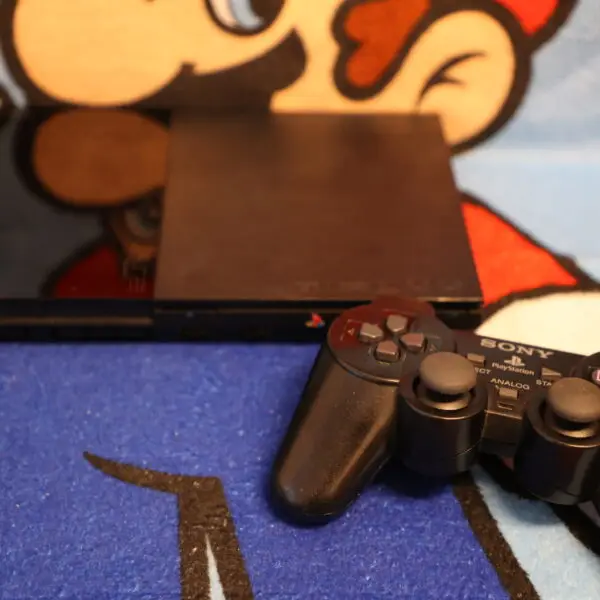 1633, 1569, 1077 - Playstation 2 Slim mit Controller