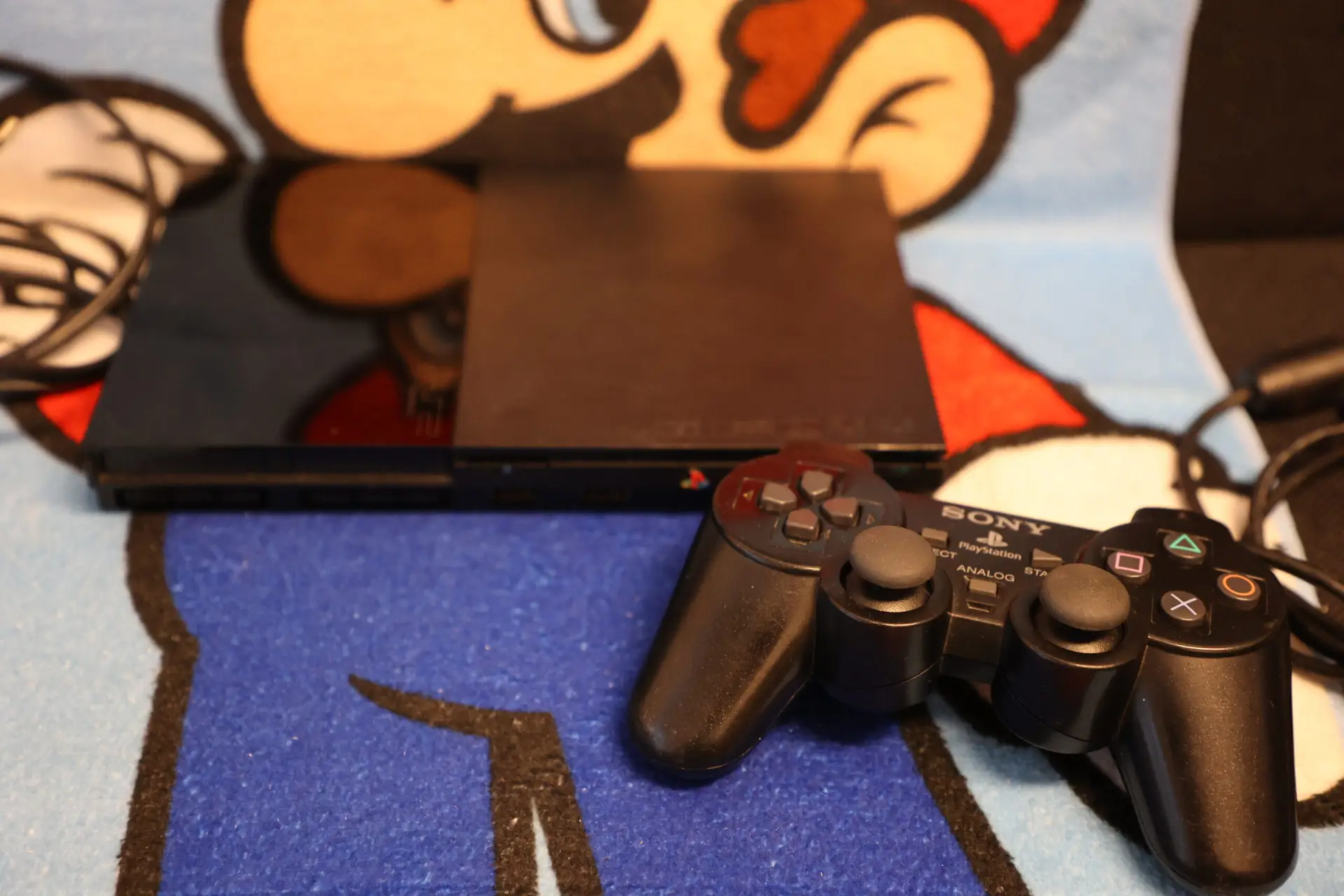 1633, 1569, 1077 - Playstation 2 Slim mit Controller